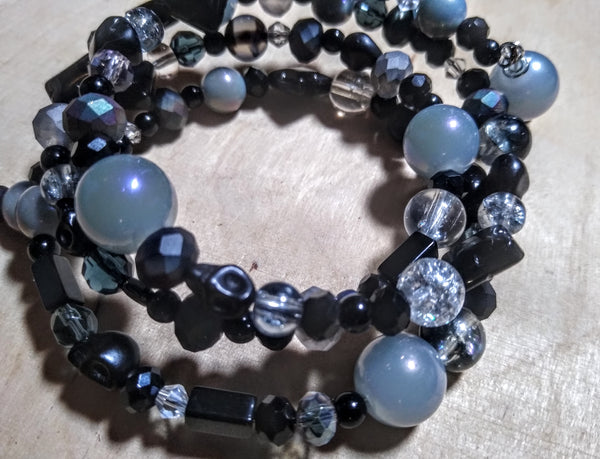 Black, Silver, and Oilslick Gray Crystal Bracelet with Black Skulls